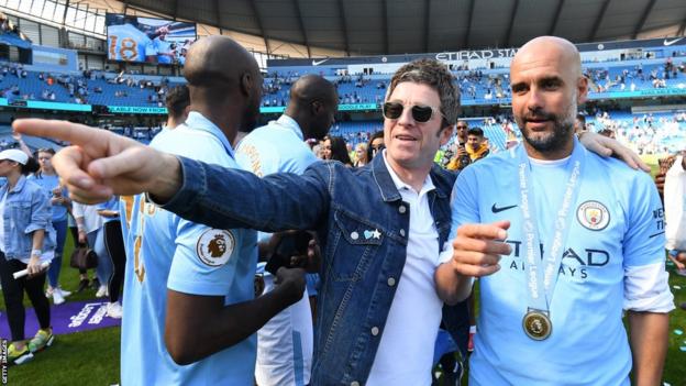 Noel and Pep celebrate City's Premier League title triumph at Etihad Stadium in 2018, at the end of his second season in charge