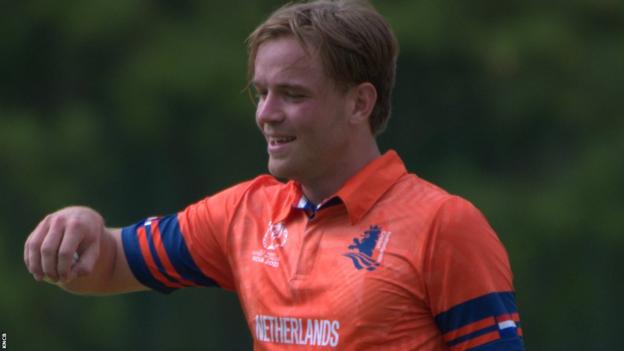 Bas de Leede smiles after bowling during a warm-up game for the Netherlands in India