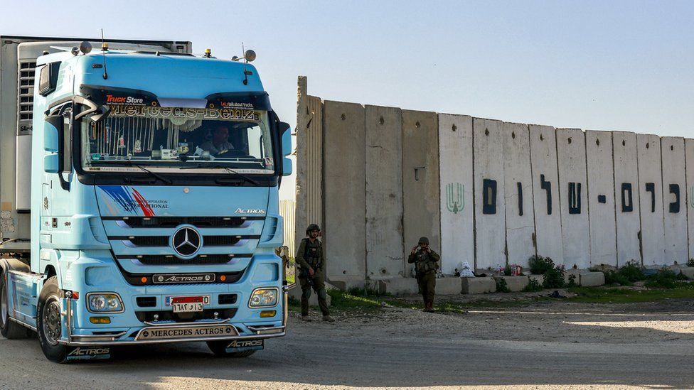An aid truck moves through the Kerem Shalom crossing from Israel to Gaza