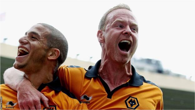 Jody Craddock celebrates with Adlene Guedioura of Wolves in 2011