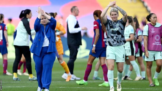 Emma Hayes and Millie Bright celebrate with Chelsea fans
